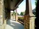 Covered front porch with stone pillars, offering a welcoming entrance to the home at 3943 Ridge Grove Way, Suwanee, GA 30024