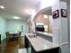 Open concept kitchen with granite countertops and a seamless view into the living room at 3943 Ridge Grove Way, Suwanee, GA 30024