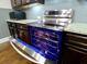 Stainless steel oven with a blue interior complements the granite countertops in this kitchen at 3943 Ridge Grove Way, Suwanee, GA 30024