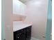 Modern laundry room with front load washer and dryer for efficient clothes care at 3943 Ridge Grove Way, Suwanee, GA 30024