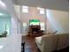 Open living room showcases a fireplace, large windows, and a cozy seating arrangement at 3943 Ridge Grove Way, Suwanee, GA 30024