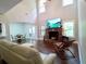 Bright living room with fireplace and hardwood floors offers a cozy and inviting atmosphere at 3943 Ridge Grove Way, Suwanee, GA 30024