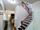 Open living space with fireplace, hardwood floors, stairs, and modern finishes at 3943 Ridge Grove Way, Suwanee, GA 30024