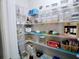 Walk-in pantry with organized shelving and ample storage space at 3943 Ridge Grove Way, Suwanee, GA 30024