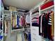 Spacious walk-in closet providing ample space for folded and hanging items at 3943 Ridge Grove Way, Suwanee, GA 30024