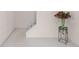 Neutral basement features plush carpeting, white trim, and a decorative bouquet to add color to the room at 535 Sugar Gate Ct, Lawrenceville, GA 30044