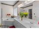 Bright bathroom featuring a shower, bathtub, and white sink at 535 Sugar Gate Ct, Lawrenceville, GA 30044