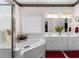 Bathroom featuring a shower, bathtub, and white sink at 535 Sugar Gate Ct, Lawrenceville, GA 30044