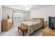 Bright bedroom featuring neutral color palette, decorative ceiling fan, and large windows at 535 Sugar Gate Ct, Lawrenceville, GA 30044
