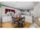 Eat-in kitchen features a wooden dining table adjacent to the kitchen area at 535 Sugar Gate Ct, Lawrenceville, GA 30044