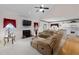 Bright living room with vaulted ceilings, fireplace, and access to the kitchen and backyard at 535 Sugar Gate Ct, Lawrenceville, GA 30044