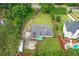 Aerial view of a home with lush greenery, pool and RV parking at 2221 Shallowford Rd, Marietta, GA 30066