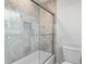 Bathroom featuring tiled shower with glass doors and built-in niche for storage at 2221 Shallowford Rd, Marietta, GA 30066