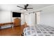 Bedroom with hardwood floors, a ceiling fan, and a sliding barn door at 2221 Shallowford Rd, Marietta, GA 30066
