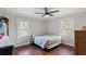 Cozy bedroom with hardwood floors, neutral paint, and large windows offering ample natural light at 2221 Shallowford Rd, Marietta, GA 30066