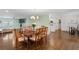 Open-concept dining room with hardwood floors conveniently located next to the kitchen and living room at 2221 Shallowford Rd, Marietta, GA 30066