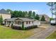 Exterior shot of charming ranch with brick facade and well-kept lawn at 2221 Shallowford Rd, Marietta, GA 30066