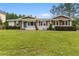 Charming brick home featuring a well-manicured lawn and classic shutters at 2221 Shallowford Rd, Marietta, GA 30066