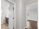 Hallway showcasing access to bathroom and bedroom with natural light at 2221 Shallowford Rd, Marietta, GA 30066