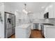 Modern kitchen featuring stainless steel appliances, island with quartz countertops, and ample storage at 2221 Shallowford Rd, Marietta, GA 30066