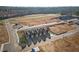 Aerial view of new townhomes, showcasing their layout and surrounding development area in a sunny landscape at 225 Ivey Ter, Temple, GA 30179