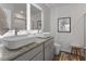 Bathroom featuring double sink vanity, granite countertop, and modern fixtures at 225 Ivey Ter, Temple, GA 30179