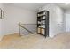 Upstairs hallway featuring carpet, storage, and doors to other rooms at 225 Ivey Ter, Temple, GA 30179