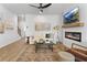 Cozy living room with fireplace, stylish decor, wood floors, and modern furnishings for relaxing at 225 Ivey Ter, Temple, GA 30179