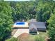 Home exterior with an in-ground pool and a spacious patio, offering a private and luxurious outdoor space at 2652 Mount Tabor Church Rd, Dallas, GA 30157