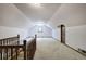 Attic featuring neutral carpet, natural light, and wooden trim door at 2652 Mount Tabor Church Rd, Dallas, GA 30157