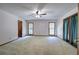 Large bedroom with carpet, two windows, a ceiling fan, and closet at 2652 Mount Tabor Church Rd, Dallas, GA 30157