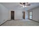 Bright bedroom with carpet, a ceiling fan, and a large closet at 2652 Mount Tabor Church Rd, Dallas, GA 30157
