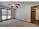 Carpeted bedroom with large window and a bathroom view at 2652 Mount Tabor Church Rd, Dallas, GA 30157