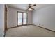 Bedroom with a ceiling fan and view of the outdoor pool at 2652 Mount Tabor Church Rd, Dallas, GA 30157