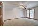 Bright bedroom with neutral carpet, ceiling fan, and a window offering ample natural light at 2652 Mount Tabor Church Rd, Dallas, GA 30157
