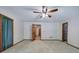 Spacious bedroom with soft carpet, ceiling fan, and a walk-in closet at 2652 Mount Tabor Church Rd, Dallas, GA 30157