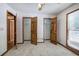 Carpeted bedroom with a ceiling fan, closet and natural light at 2652 Mount Tabor Church Rd, Dallas, GA 30157