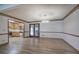 Open dining room view of kitchen, hardwood floors, and doors leading to backyard at 2652 Mount Tabor Church Rd, Dallas, GA 30157