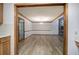 Bright dining room featuring hardwood floors and view of stone fireplace at 2652 Mount Tabor Church Rd, Dallas, GA 30157