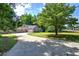 Street view of home featuring a long driveway and a well-maintained yard at 2652 Mount Tabor Church Rd, Dallas, GA 30157