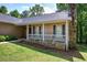 A cozy front porch with stone accents and a welcoming entrance at 2652 Mount Tabor Church Rd, Dallas, GA 30157