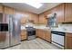Kitchen featuring stainless steel appliances, wood cabinets, and white countertops at 2652 Mount Tabor Church Rd, Dallas, GA 30157