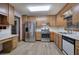 Kitchen featuring stainless steel appliances, wooden cabinets, and a window for natural light at 2652 Mount Tabor Church Rd, Dallas, GA 30157