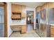 Kitchen featuring a desk, stainless steel refrigerator, and wood cabinets at 2652 Mount Tabor Church Rd, Dallas, GA 30157