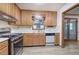 Traditional kitchen featuring wood cabinetry, stainless steel range, and white countertops at 2652 Mount Tabor Church Rd, Dallas, GA 30157