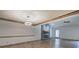 Open living room with stone fireplace, hardwood floors, and modern lighting at 2652 Mount Tabor Church Rd, Dallas, GA 30157