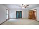 Bedroom featuring neutral carpet, wood trim doors, and a window with curtains at 2652 Mount Tabor Church Rd, Dallas, GA 30157