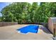 Backyard view of the inground pool with a playhouse in the background at 2652 Mount Tabor Church Rd, Dallas, GA 30157