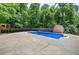 Backyard view of the inground swimming pool with a storage shed and a playhouse at 2652 Mount Tabor Church Rd, Dallas, GA 30157