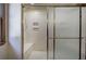 Shower featuring a built-in bench seat and sliding doors that create a relaxing atmosphere at 2652 Mount Tabor Church Rd, Dallas, GA 30157